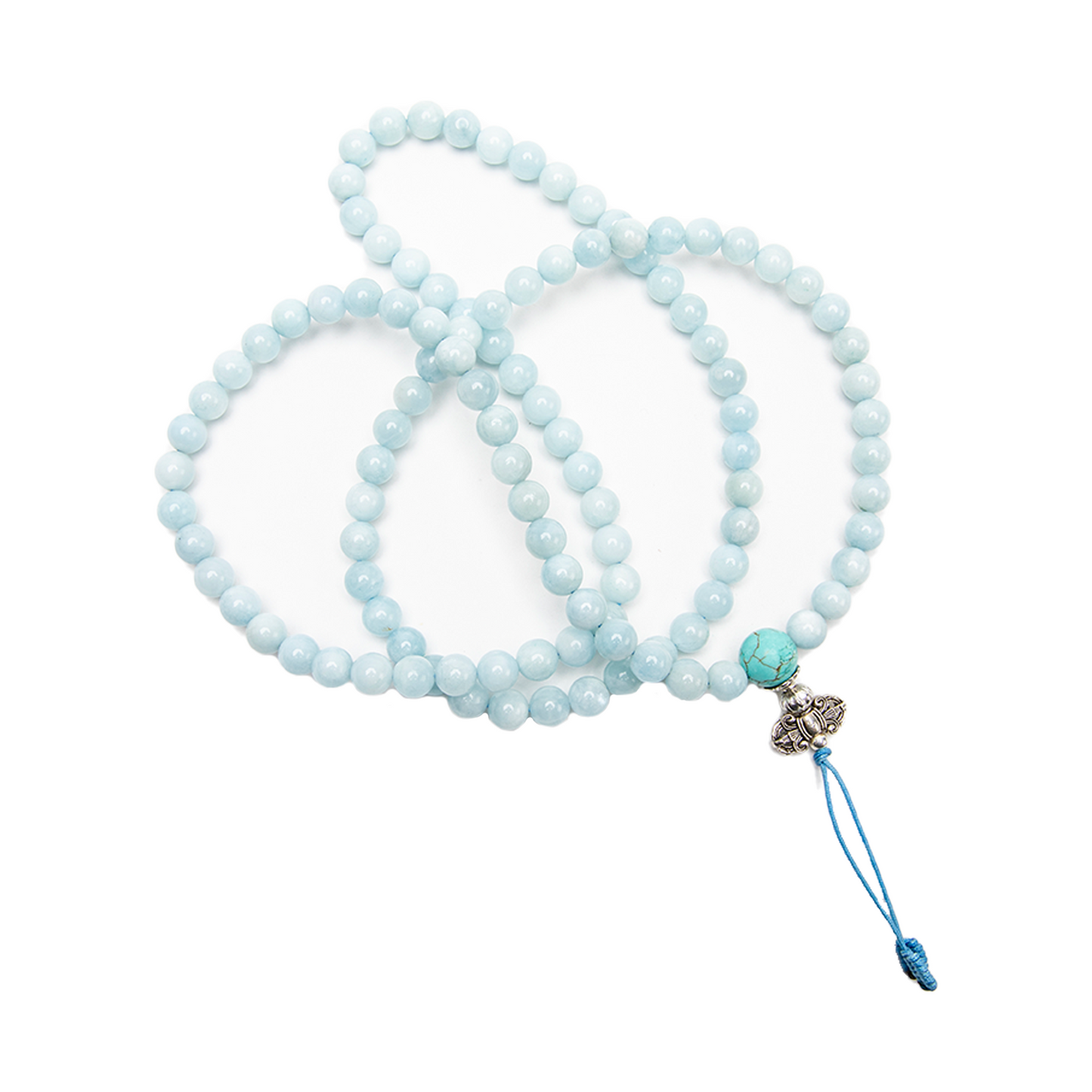 The Aquamarine Mala, 108 bead rests against a solid white backdrop, delicately coiled over itself.