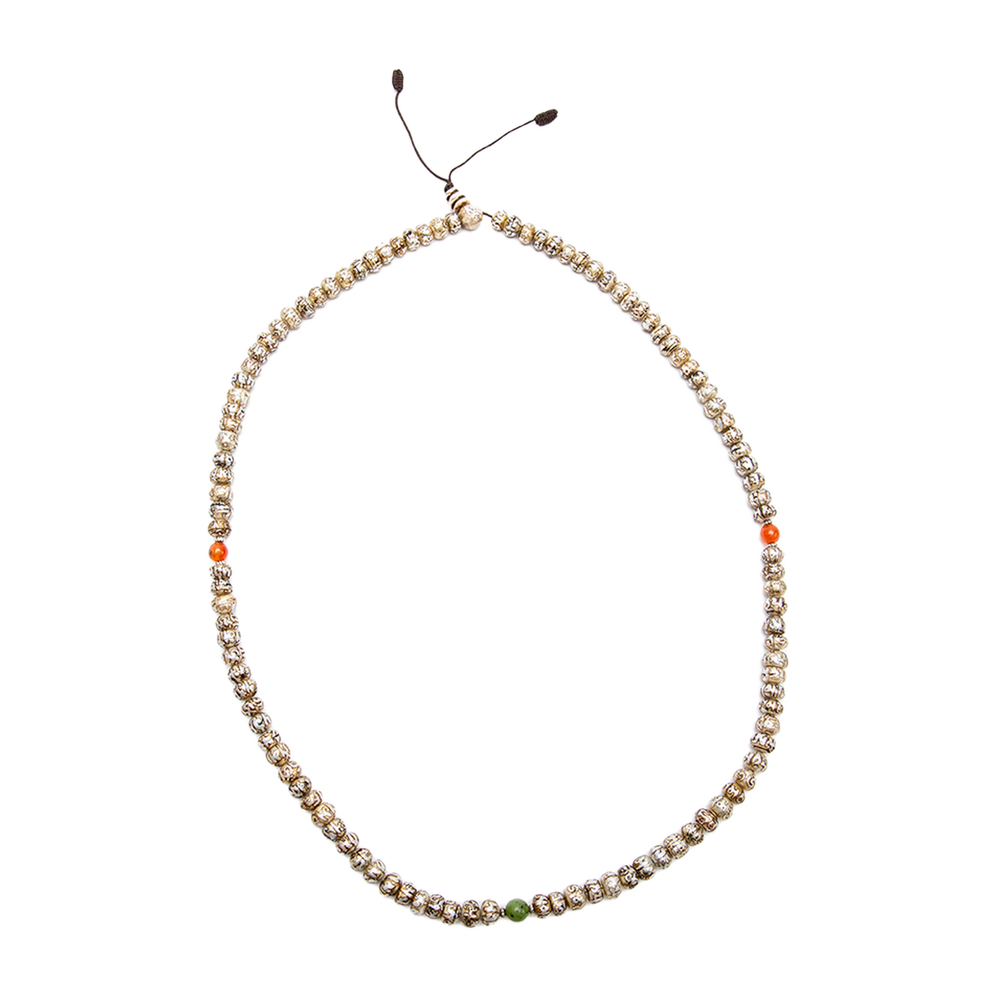 The Fresh Water Pearl Mala rests on a solid white backdrop. It is laid flat to form a perfect oval.