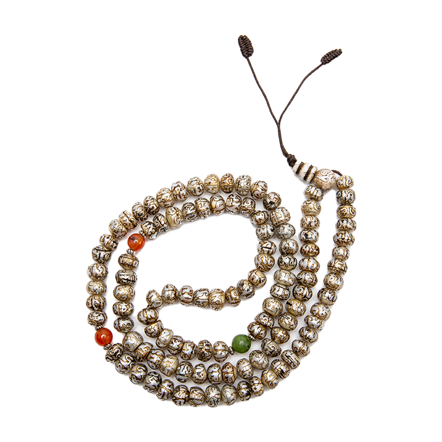 Fresh Water Pearl Mala rests against a white backdrop and loosely coiled into a circle.