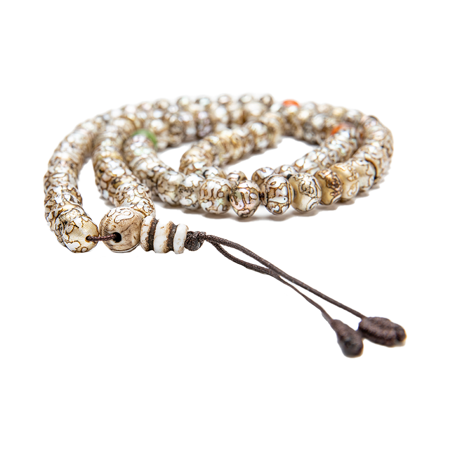 Close-up of the Fresh Water Pearl Mala on a solid white backdrop. The mala rests flat at nearly eye-level, with the guru bead and knot close to the camera and in focus.