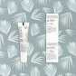 Back side views of BAIOBAY Coconut Oil Lip Balm tube and box, side by side on a botanical backdrop.